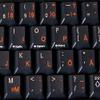 Swedish - Finnish Keyboard Stickers with Orange Lettering ON Transparent Background view 3