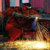 Senior Airman uses an acetylene torch to cut metal Poster Print by Stocktrek Images (22 x 34) view 1