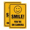 (2 Pack) Smile You're On Camera Video Surveillance Sign - 10 x7 Inches .040 Rust Free Heavy Duty Aluminum - Indoor or Outdoor Use for Home Business CCTV Security Camera,UV Protected & Reflective view 1