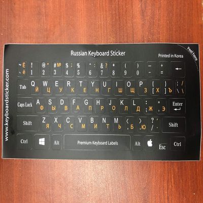 . . . Keyboard Stickers. Orange Letters on a Black Background. Korea Production