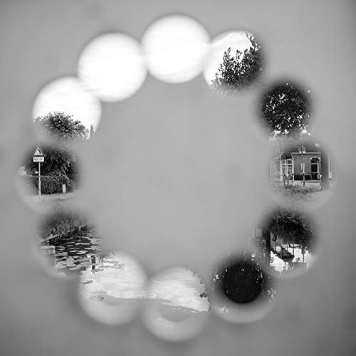 Home Comforts Holes Black And White Peek Circles Round Dial-20 Inch By 30 Inch Laminated Poster With Bright Colors And Vivid Imagery-Fits Perfectly In Many Attractive Frames