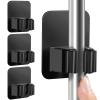 DOMAXCAI 4 Pack Broom Holder Wall Mount, Improved Super Anti-Slip Mop and Broom Holder Wall Mount, Broom Hanger Gripper for Kitchen, Bathroom, Closet, Garden Garage, Black view 1