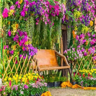 BELECO 8x6ft Fabric Summer Garden Backdrops for Photography Romantic Park Scenery Colorful Flowers Green Plants Wooden Chairs Background Birthday Wedding Photoshoot Garden Party Decor Photo Props