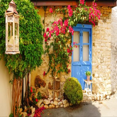 BELECO 15x10ft Fabric Greek Stone House Backdrop Greece Style Blue Wooden Door Bushes Flowers Background Greek Theme Party Decorations Kids Adults Photoshoot Studio Props
