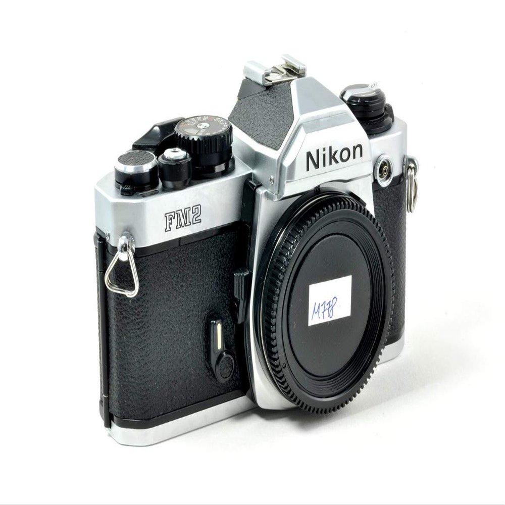 Nikon FM2 35MM SLR Film Camera with Titanium Shutter Manual focus FX Nikon Lens system (Renewed)