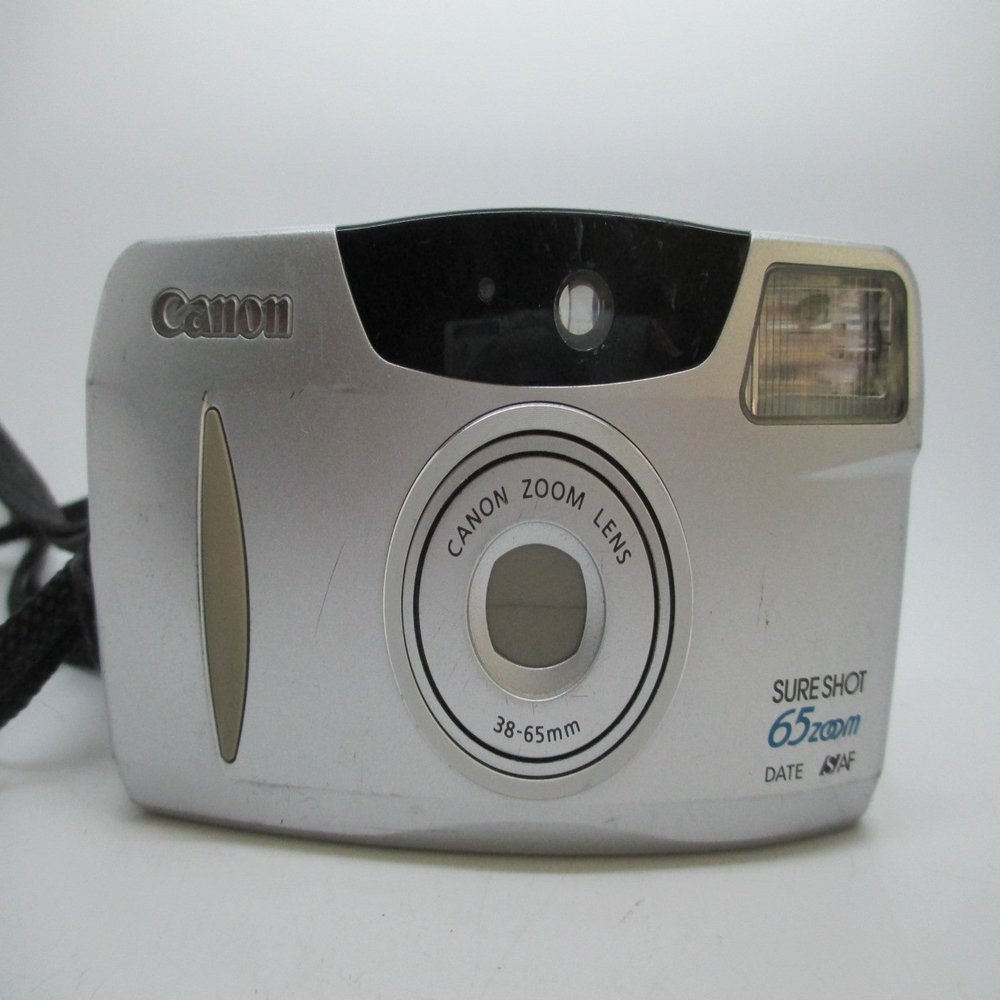 Canon Sure Shot 65 Zoom Date 35mm Point And Shoot Film Camera w/ Built-in Flash and Motor Drive (Renewed)