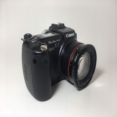 Canon Powershot Pro 1 8MP Digital Camera 7X Optical Zoom 7.2-50.8MM 2.4-3.5 L Lens (Renewed)