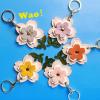 MC Fashion PU Leather AirTag Keychain Holder Case, 3D Cherry Flower Floral Key Ring Charm GPS Tracker Case (Purple) view 2
