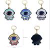 MC Fashion PU Leather Keychain Holder Case Compatible with AirTag, Creative Astronaut GPS Tracker Case Charm Key Ring (Blue) view 2
