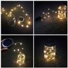 Solar Mason Jar Lights, 4 Pack 30 LEDs Waterproof Fairy Firefly String Lights Build-in Glass Mason Jar, Best Patio Garden Decor Solar Hanging Lanterns Outdoor Warm White (4 Pack-Mason Jars Included) view 3