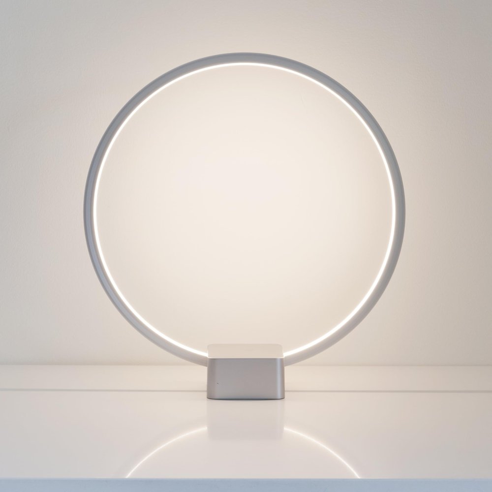 Brightech Circle LED Nightstand Lamp with USB Port  Compact Bed Stand Lamp for Bedroom, Living Room - Modern Asian Table & Desk Lamp on Side & End Tables - Titanium Sliver