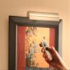 Antique Brass Cordless LED Picture Light 7 Wide with Remote Control and dimmer Switch view 2